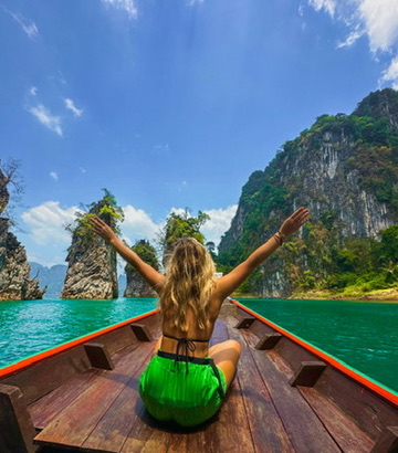 Rachel exploring Thailand by longtail boat